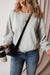 Grey sweatshirt with exposed seams, batwing sleeves and dropped shoulders