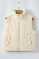 Gilet matelassé beige en velours côtelé à col montant, zippé