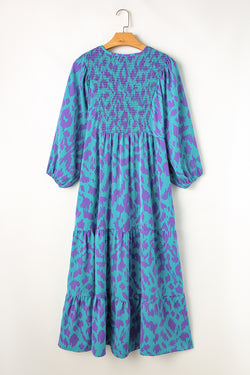 Sky blue long dress with abstract print, puffed sleeves, knotted and notched collar