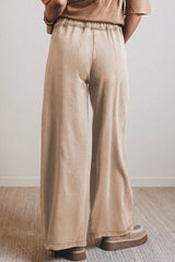 Pantalon large en coton délavé à taille haute, cordon et poches plaquées