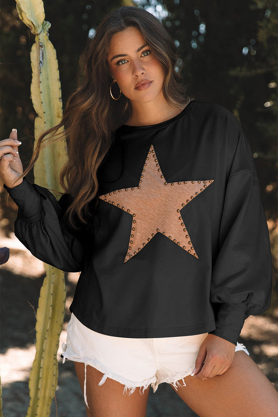 Black oversized high with long sleeves and studded star pattern