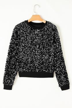 Black short blouse with glitter and round neck with long sleeves