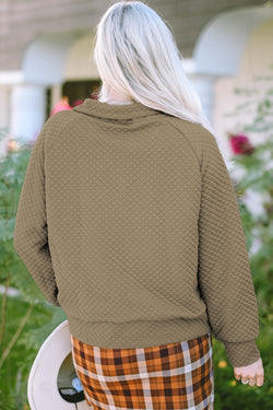 Apricot quilted sweatshirt with button-down neckline and stand-up collar