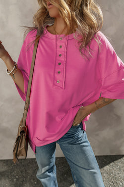 High tunic with wide sleeves and buttoned collar with apparent red pink seams