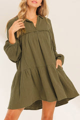 Green flared dress with frayed edging, split collar, puffed sleeves
