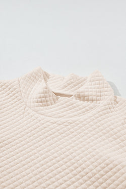 Apricot quilted sweatshirt with stand-up collar and kangaroo pocket