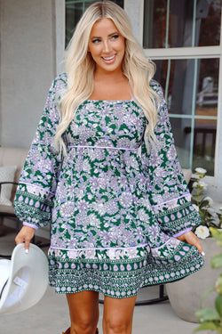 Green dress with floral print and border *