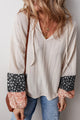 Blusa beige con cordón apretado *