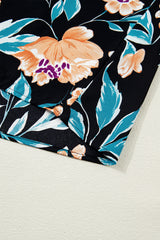 Chemisier noir à fleurs, manches courtes bouffantes