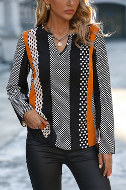 Orange blouse with geometric print and color block notch collar