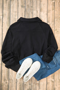 Black sweatshirt with stand-up collar and kangaroo pocket with quarter-turn zip