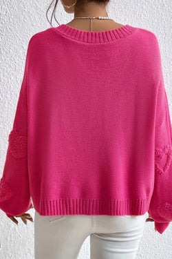 V -neck sweater and stuffed hearts decorated with pink red pearls