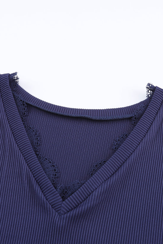 Blue long sleeve v-neck top with lace trim and ribbed texture