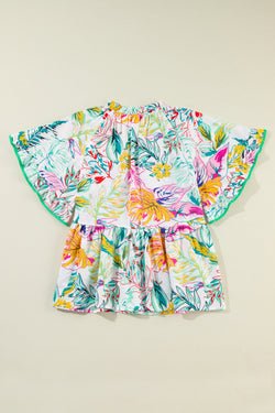 White blouse with short sleeves and ruffles with tropical floral print