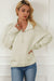 Beige sweater with dolman sleeves and buttoned stand-up collar with pearls