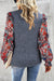 Pale brush blue blouse with ruffles and floral sleeves on several levels and round neck