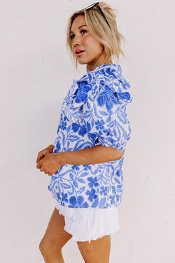 Blusa azul oscuro con estampado floral *