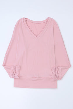 Long sleeve top and pink V -collar with ribbed texture and lace border