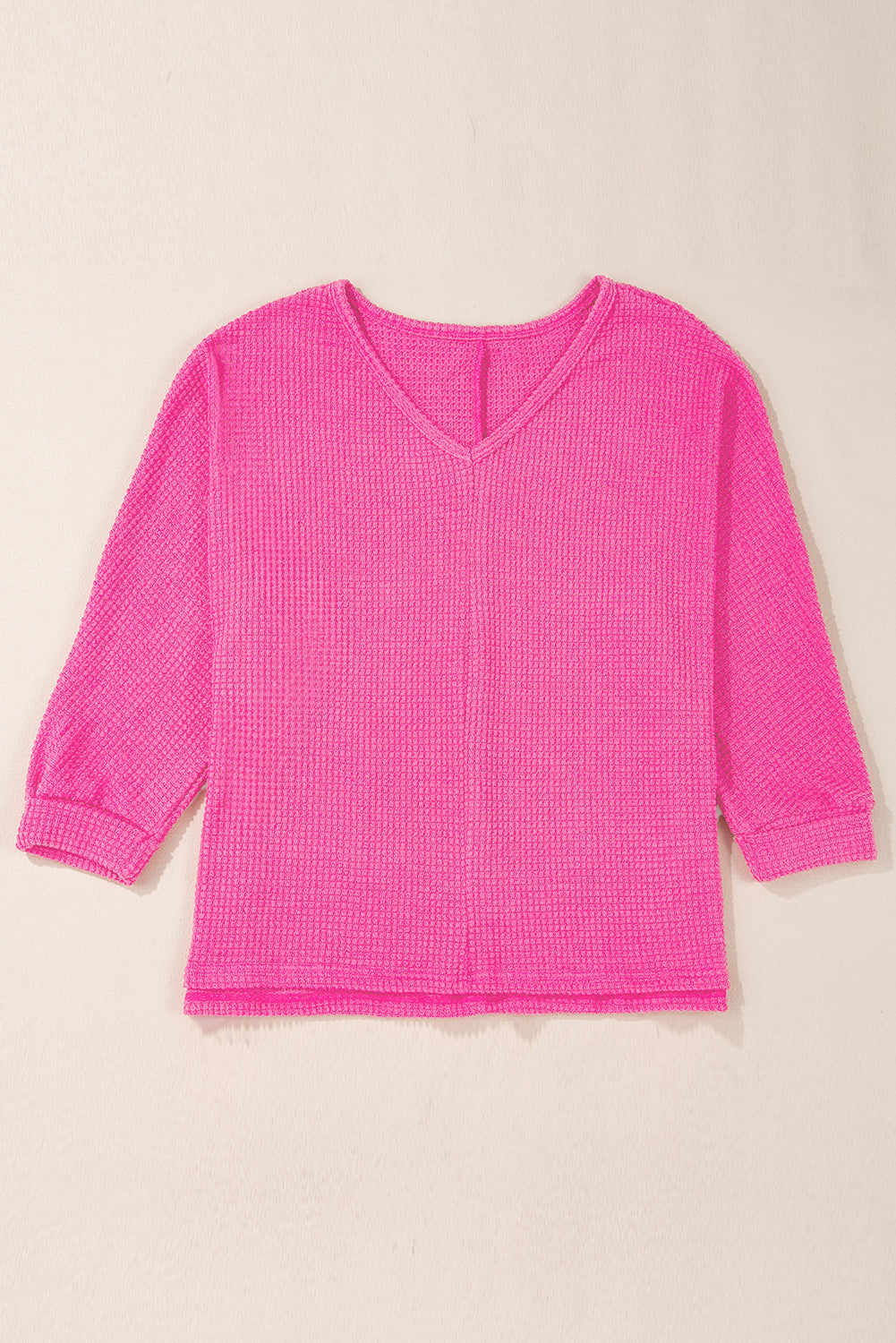 Haut ample à col en V et fentes latérales en tricot *