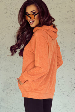 Orange hooded sweatshirt with tightening cord and kangaroo pocket with mineral washing