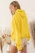 Yellow zip-up hoodie with kangaroo pocket and ribbed trim