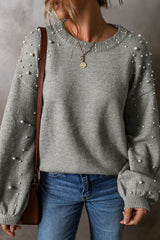 Pull gris clair à col rond et épaules tombantes perlées