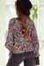 Multicolored V -collar blouse and long sleeves with ruffles and floral print