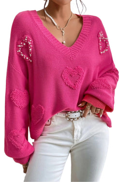 V -neck sweater and stuffed hearts decorated with pink red pearls