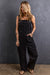 Black denim overalls with adjustable straps and multiple pockets