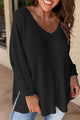 Ample black with V -neck and side slits *