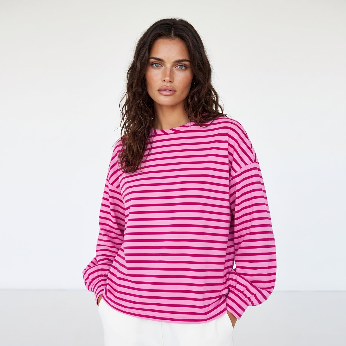 Striking pink sweatshirt and neck and falling shoulders