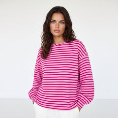 Striking pink sweatshirt and neck and falling shoulders