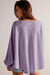 Ample blouse with embossed orchid petals, V -neck, long sleeves, falling shoulders