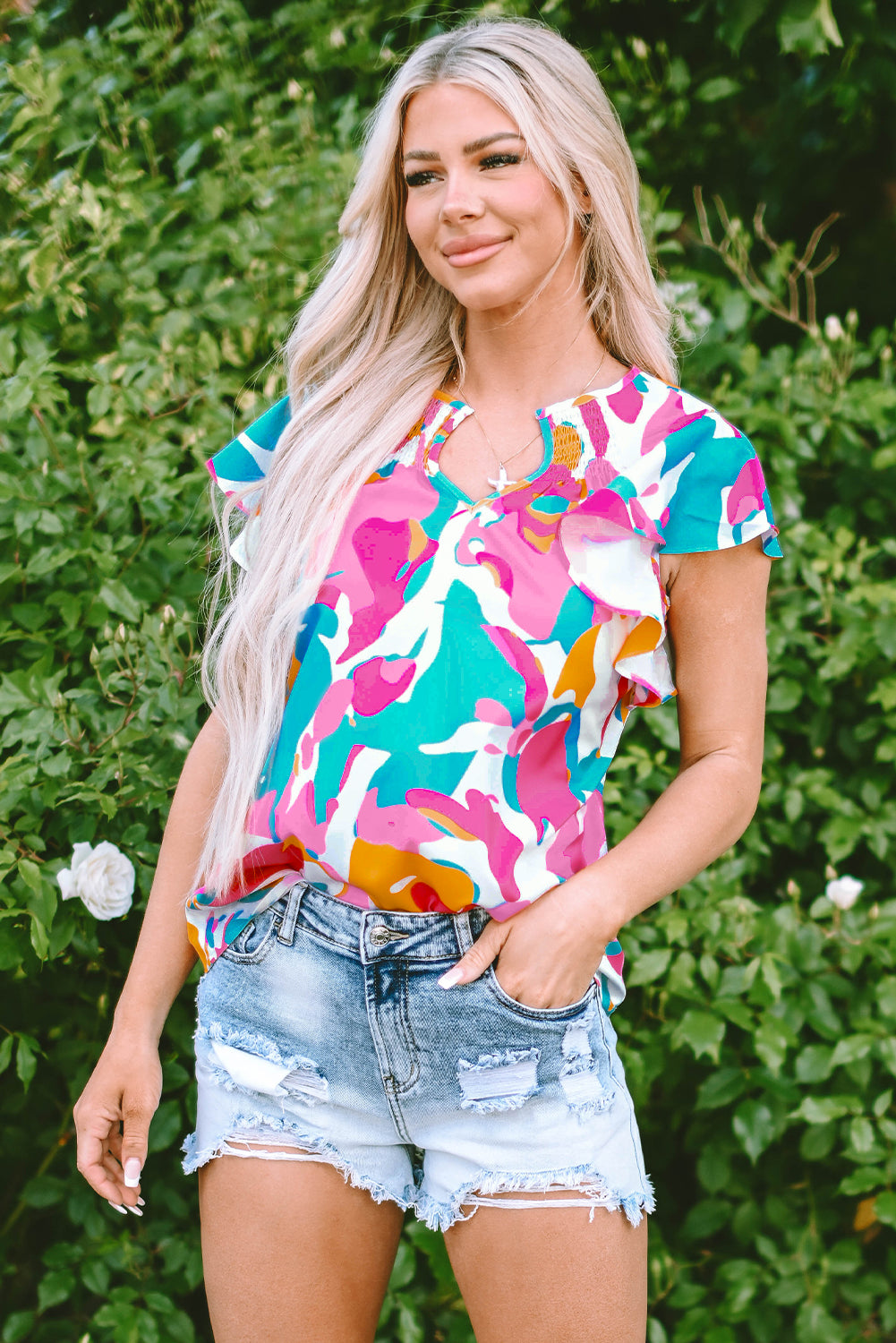 Multicolored blouse with abstract print and notched collar with floating sleeves