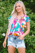 Multicolored blouse with abstract print and notched collar with floating sleeves