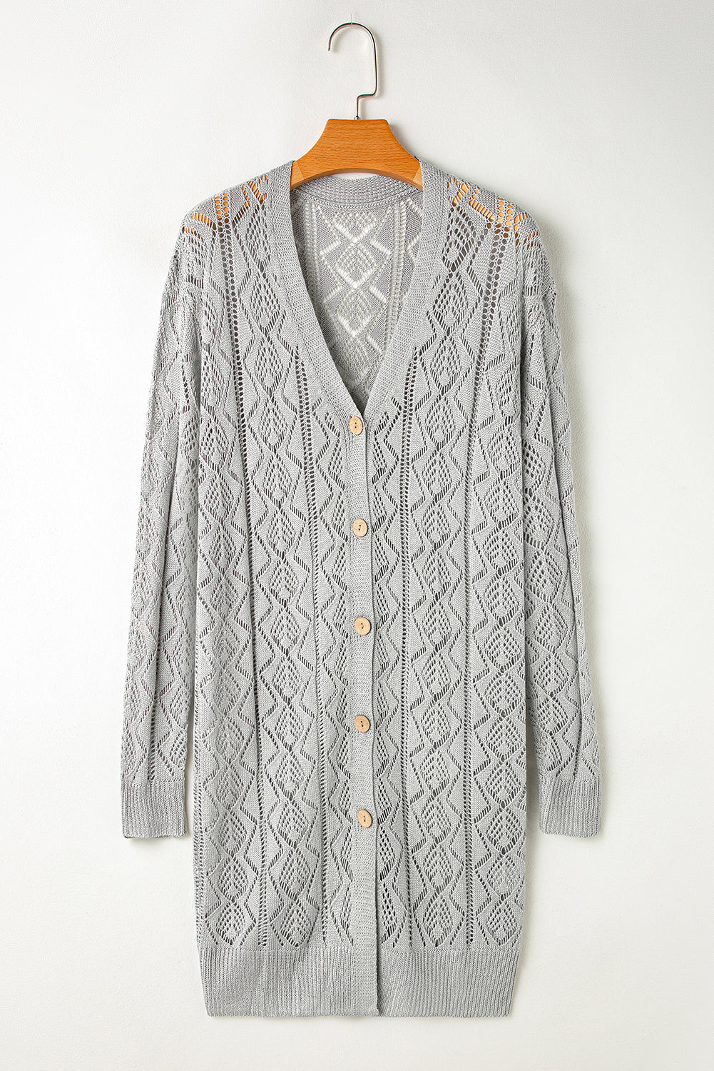 Long gray cardigan with openwork buttons on the front