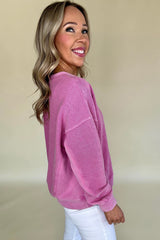 Hot pink sweatshirt with dropped shoulders and solid color notched collar