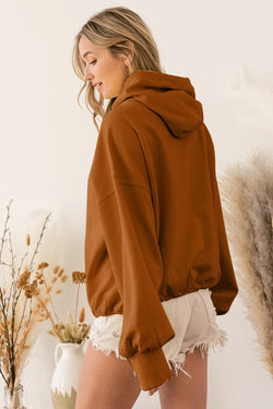 Brown zip-up hoodie with kangaroo pocket and ribbed trim