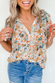 Multicolor blouse split in V -neck and puffy sleeves with floral print