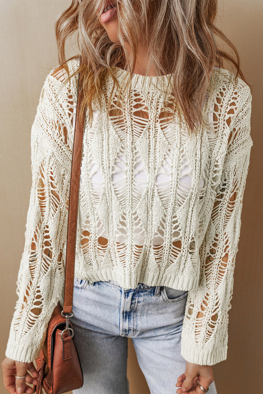 White crew neck loose sweater with crochet cutouts