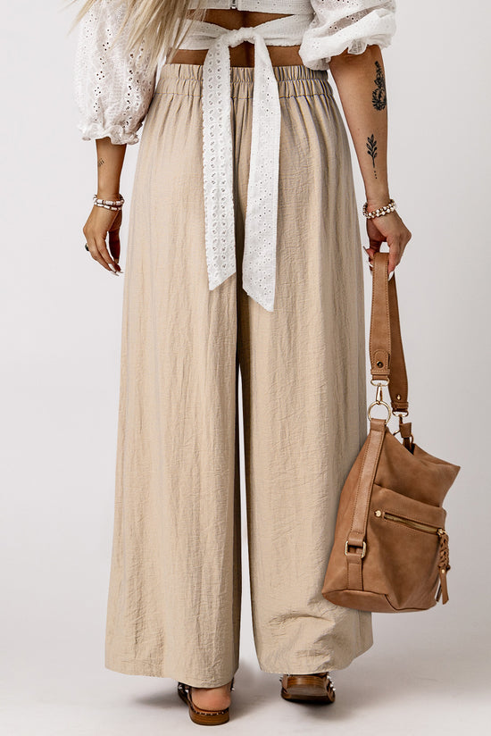 Large pleated leg relaxed pants with beige tightening cord