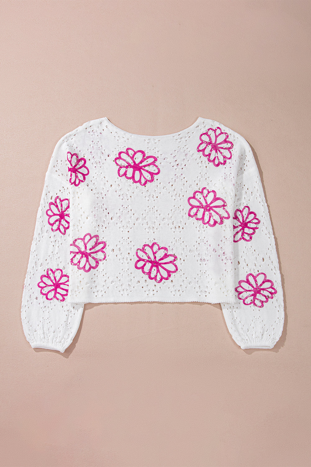 Sweater blanco de hombro blanco y ojales con estampado floral contrastante