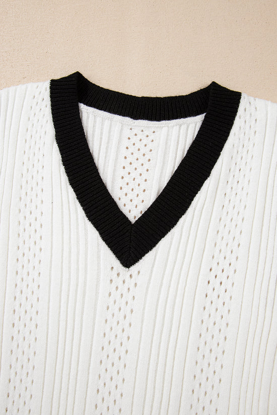 V -neck sweater in knitting with eyelets and border *