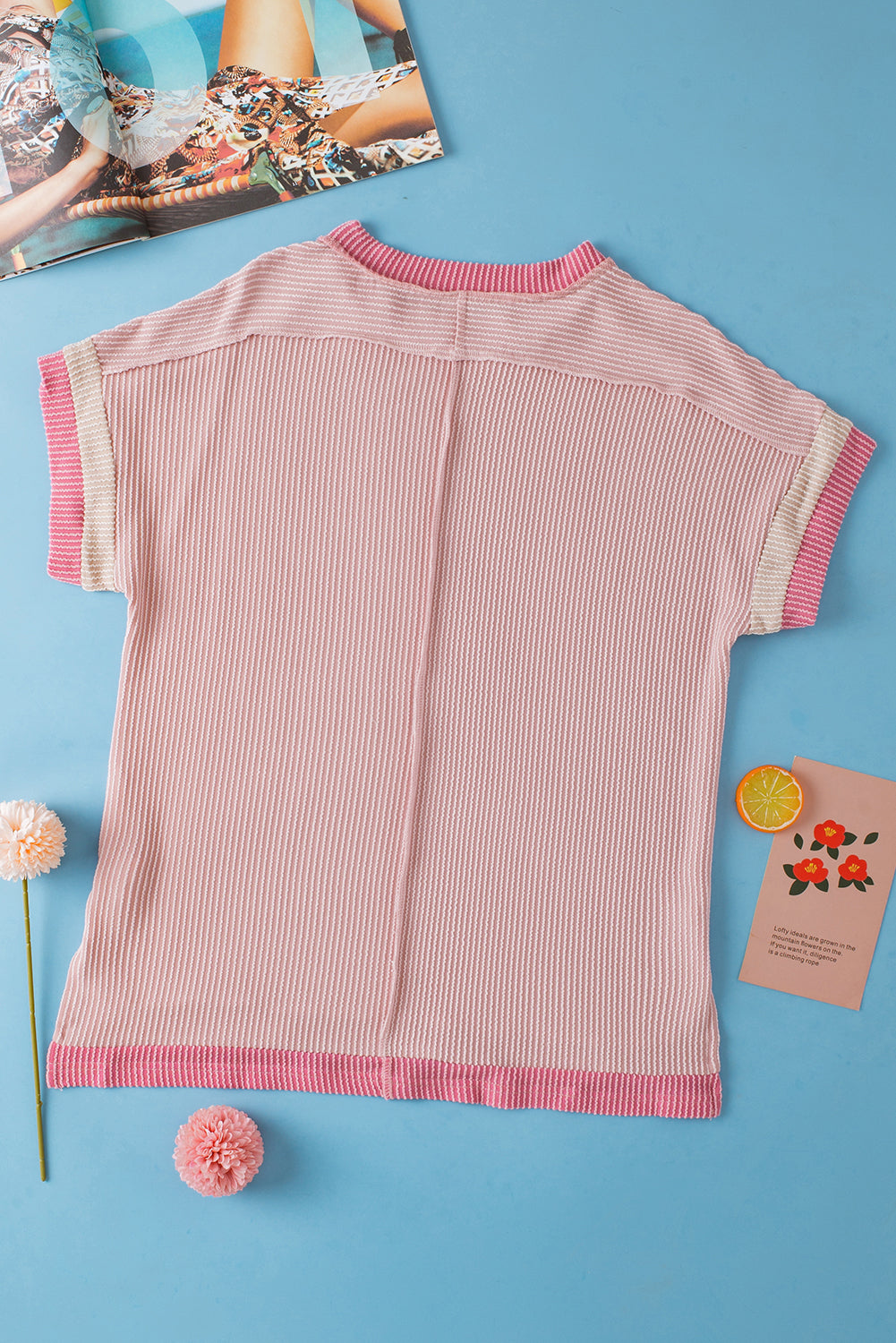 Light pink t-shirt with round neck and contrasting textured border