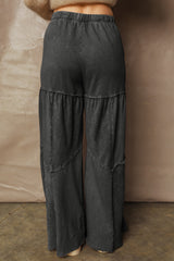 Pantalon large noir délavé à empiècements et coutures apparentes