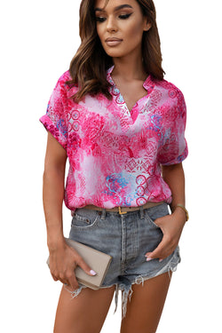 Short -sleeved blouse rolled with V -neck and pink abstract floral print