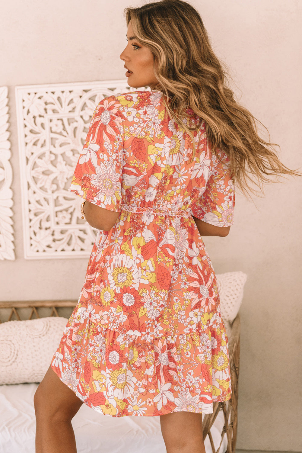 Orange floral dress with wide, flowing sleeves