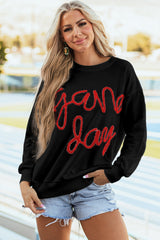 Sudadera gráfica negra con hombros caídos Día del juego de oropel