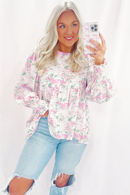 Babydoll pink blouse with floral print and frozen balloon sleeves with lock hole on the back