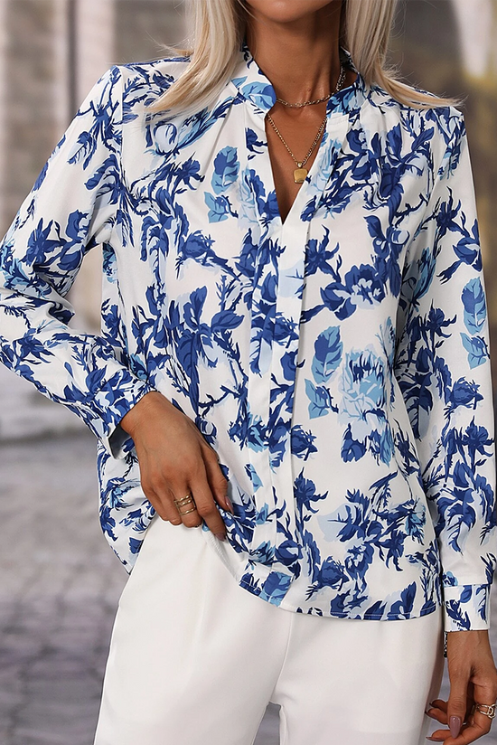 Elegante blusa con cuello con muescas y estampado floral azul floral